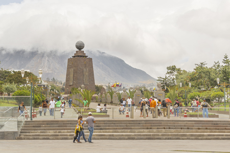QUITO, ECUADOR, OCTOBER - 2015 - Group of tourists visiting the most visited touristic location in Ecuador, the middle earth monument.のeditorial素材