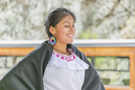 ALAUSI, ECUADOR, OCTOBER - 2015 - Beautiful ecuadorian native young woman making an exhibition of traditional ecuadorian indigenous dance at nariz del diablo trip in Alausi, Ecuadorのeditorial素材