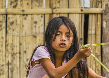 PUYO, ECUADOR, OCTOBER - 2015 - Portrait of amazonic indigenous ecuadorian kid in Puyo, Ecuador.のeditorial素材