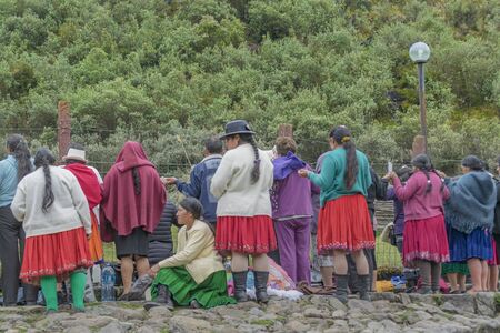 CUENCA, ECUADOR, OCTOBER - 2015 - Group of native ecuadorian catholic indigenous praying at outdoors in Cuenca outskirts, Ecuador, South Americaのeditorial素材