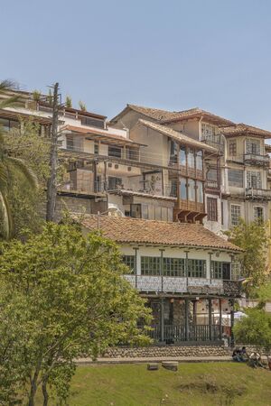 CUENCA, ECUADOR, NOVEMBER - 2015 - Low angle view of elegant old style eclectic buildings at Cuenca, Ecuador.のeditorial素材
