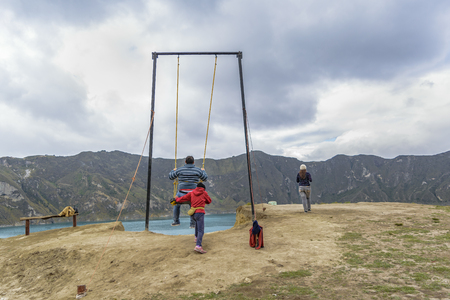Quilotoa lake and andes range mountain against overcast cloudy background landscape scene, Ecuadorのeditorial素材