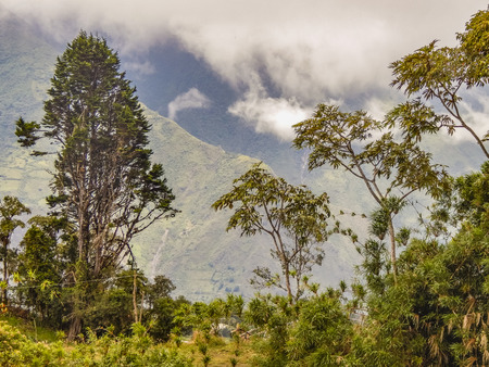 Landscape scene from top of hill in Banos, a traditional ecuadorian vacation spot town located in Ecuador.の写真素材