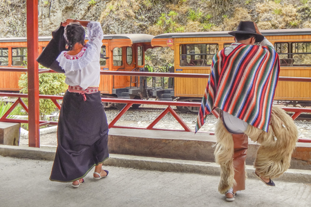 ALAUSI, ECUADOR, OCTOBER - 2015 - Couple making an exhibition of traditional ecuadorian indigenous dance at nariz del diablo tourのeditorial素材