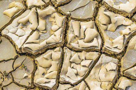 Top view of mud cracked surface pattern detail photo.