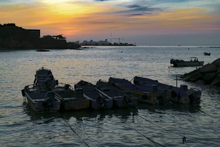 Group of fishing boats at water in La Libertad, a coastal city located in Ecuador, South Americaの写真素材