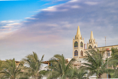 Beach and church building at malecon in La Libertad, a coastal city located in Ecuador, South...