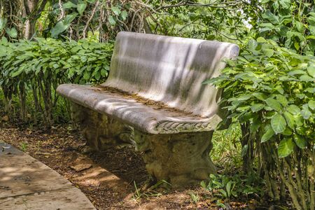 Stone rustic style seat at botanical garden of Guayaquil, Ecuadorの写真素材