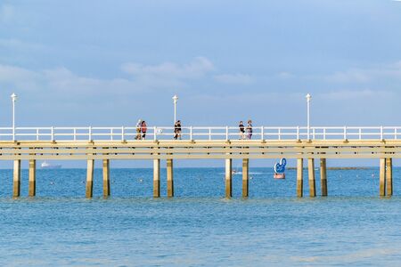 SALINAS, ECUADOR, JULY - 2016 - People at large dock at pacific ocean in Salinas, Ecuadorのeditorial素材