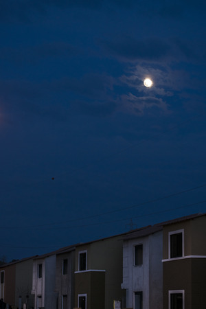 Moonscape night scene at condominium neighborhood photoの写真素材