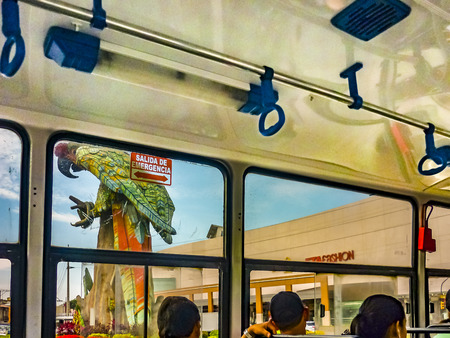 GUAYAQUIL, ECUADOR, DECEMBER - 2016 - People sitting at interior public bus in Guayaquil, Ecuadorのeditorial素材