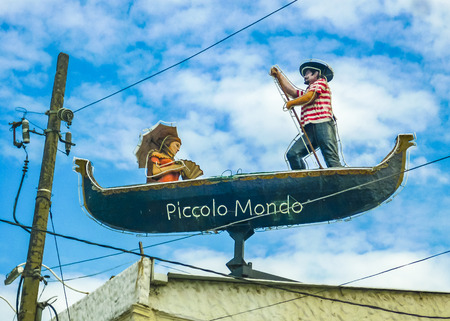 GUAYAQUIL, ECUADOR, DECEMBER - 2016 - Gondolier and woman artistic sculpture at top of roofのeditorial素材