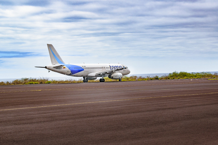 Commercial plane leaving runway at Galapagos airport, Ecuadorのeditorial素材