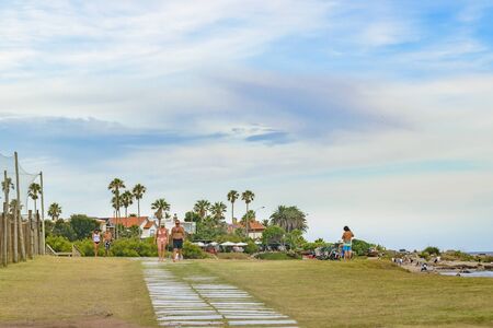 MONTEVIDEO, URUGUAY, JANUARY - 2016 - People walking at boardwalk in punta gorda neighborhood, Montevideo, Uruguayのeditorial素材
