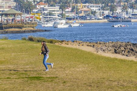 PUNTA DEL ESTE, URUGUAY, AUGUST - 2016 - Sunny winter day at waterfront park in Punta del Este city, Uruguayのeditorial素材
