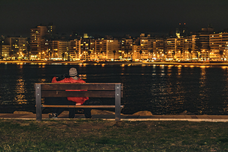 MONTEVIDEO, URUGUAY, AUGUST -2016 - Cityscape coastal urban night scene at Montevideo, Uruguayの写真素材