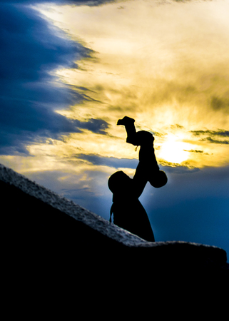 PIRIAPOLIS, URUGUAY, FEBRUARY - 2016 - Family at top of San Antonio hill at sunset time.