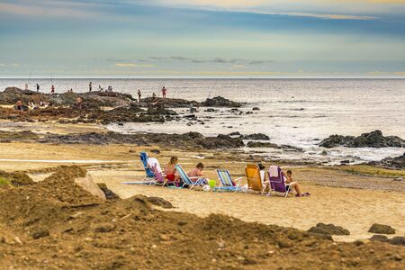 MONTEVIDEO, URUGUAY, FEBRUARY - 2016 - People at rocky beach in Maldonado province, Uruguayのeditorial素材