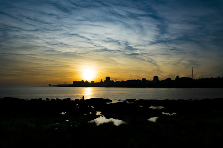 Cityscape coastal sunset scene at Montevideo city, Uruguayの写真素材