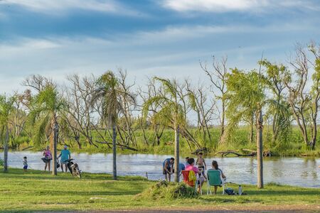 SANTA FE, ARGENTINA, JANUARY - 2017 - People enjoying a summer day at shore of parana river in San...