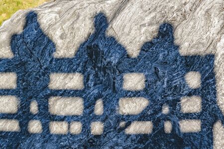 Three silhouette men shadows proected at rockの写真素材