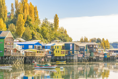 CHILOE, CHILE, APRIL - 2017 - Typical palafito houses at lake in Castro city, Chiloe Island, Chile