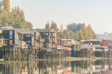 Typical palafito houses at lake in Castro city, Chiloe Island, Chile