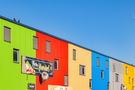 CHILOE, CHILE, APRIL - 2017 - Multicolored apartment facades at castro city, Chiloe island, Chile