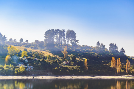 Lake and hill landscape scene at chiloe island, chileの写真素材