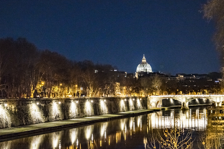 Urban cityscape night winter season scene at tiber river in Rome city, Italyの写真素材