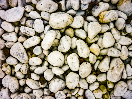 High angle shot white rounded stones texture photoの写真素材
