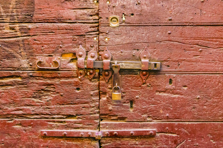 Detail view of ancient wooden door with boltの写真素材