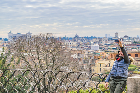 ROME, ITALY, DECEMBER - 2017 - Woman taking a selfie at monte pincio viewpoint at Villa Borgheseのeditorial素材