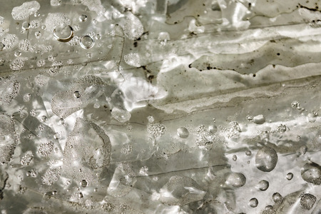 Wet nylon detail abstract texture in grey colors