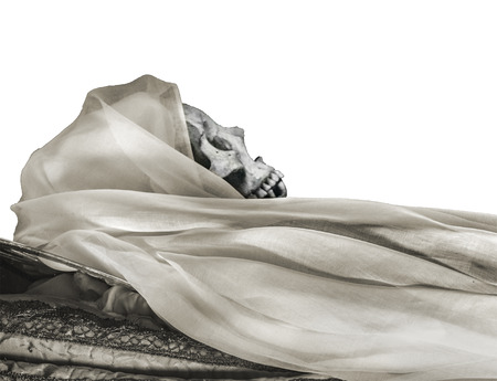 Side view shot woman skull at sleeping position isolated on white backgroundの写真素材