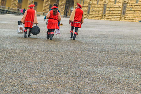 FLORENCE, ITALY, JANUARY - 2018 - Workers wearing medieval costumes at piazza pitti at historic center of florence, Italyのeditorial素材