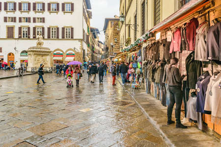 FLORENCE, ITALY, JANUARY - 2018 - Urban winter rainy scene at traditional san lorenzo market at historic center of florence, italyのeditorial素材