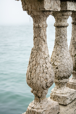 Balustrade detail view at border of lake in venice city, Italyの写真素材