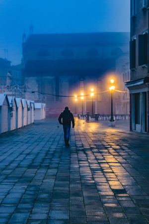 VENICE, ITALY, JANUARY - 2018 - Man walking at street in venice city, Italyのeditorial素材