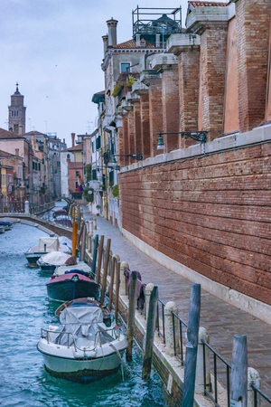 Winter urban scene at small channel at venice city, Italyの写真素材