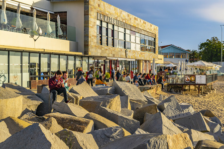 PUNTA DEL ESTE, URUGUAY, OCTOBER - 2018 - People at sunny winter scene at small port beach in punta del este city, Uruguayのeditorial素材