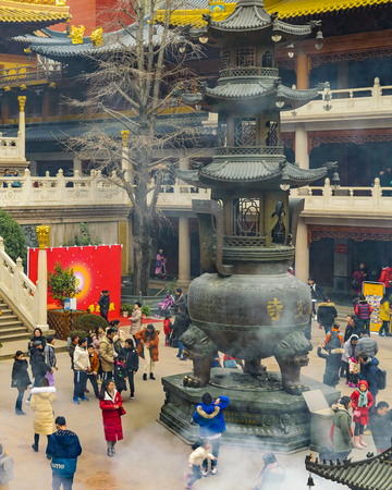 SHANGHAI, CHINA, JANUARY - 2019 - Crowd at jingan buddhist temple courtyard in shanghai city, chinaのeditorial素材