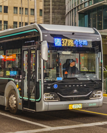 SHANGHAI, CHINA, DECEMBER - 2018 - Modern public bus waiting to advance at pudong district, shanghai, chinaのeditorial素材