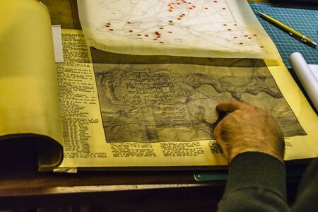Interior scene of adult artist sketching his next artwork at workshopの写真素材