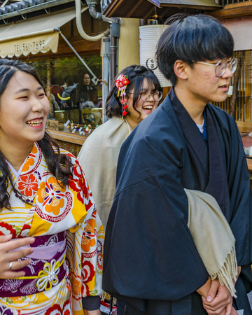 KYOTO, JAPAN, JANUARY - 2019 - Young japanese couple dressing traditional costume walking at kyoto street, japanのeditorial素材