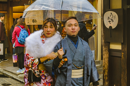 KYOTO, JAPAN, JANUARY - 2019 - Young japanese couple dressing traditional costume walking at kyoto street, japanのeditorial素材