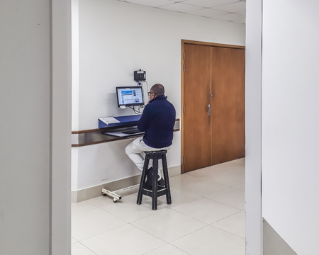 MONTEVIDEO, URUGUAY, JUNE - 2019 - Male nurse working with a computer at hospital emergency room.のeditorial素材
