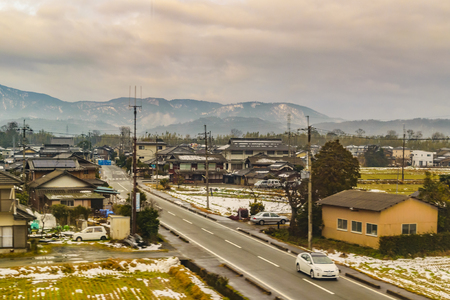 KYOTO, JAPAN, JANUARY - 2019 - Kyoto prefecture winter village cityscape scene from window train point of viewのeditorial素材