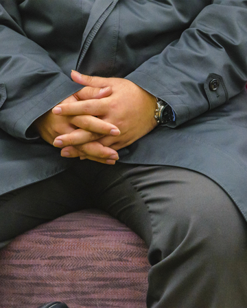 KYOTO, JAPAN, JANUARY - 2019 - Detail view of hands and part of body of fat man sitting at train seat, kyoto prefecture, japanのeditorial素材