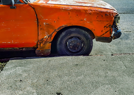 MONTEVIDEO, URUGUAY, JULY - 2019 - Abandoned damaged car parked at street in montevideo city, uruguayのeditorial素材